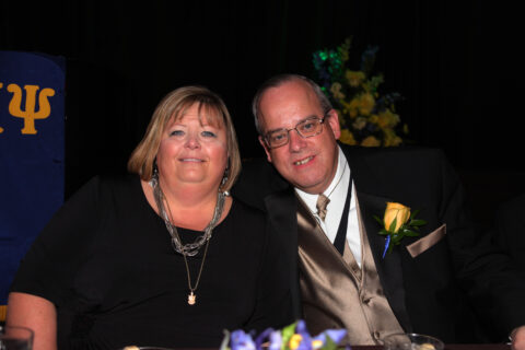 Dave and Wendy Wendroff seated at Grand Banquet at AKPsi Convention