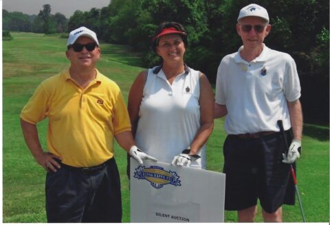 Steve and Debbie Vasquez stand will Bill Reeves at the DC Convention Golf Tournament in 2007.