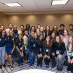 A group of students, volunteers, and certificate facilitators posing for a group photo at Elevate 2025.